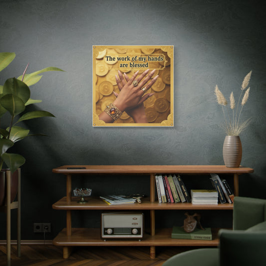 Framed artwork of hands with jewelry on a wall above a wooden shelf.